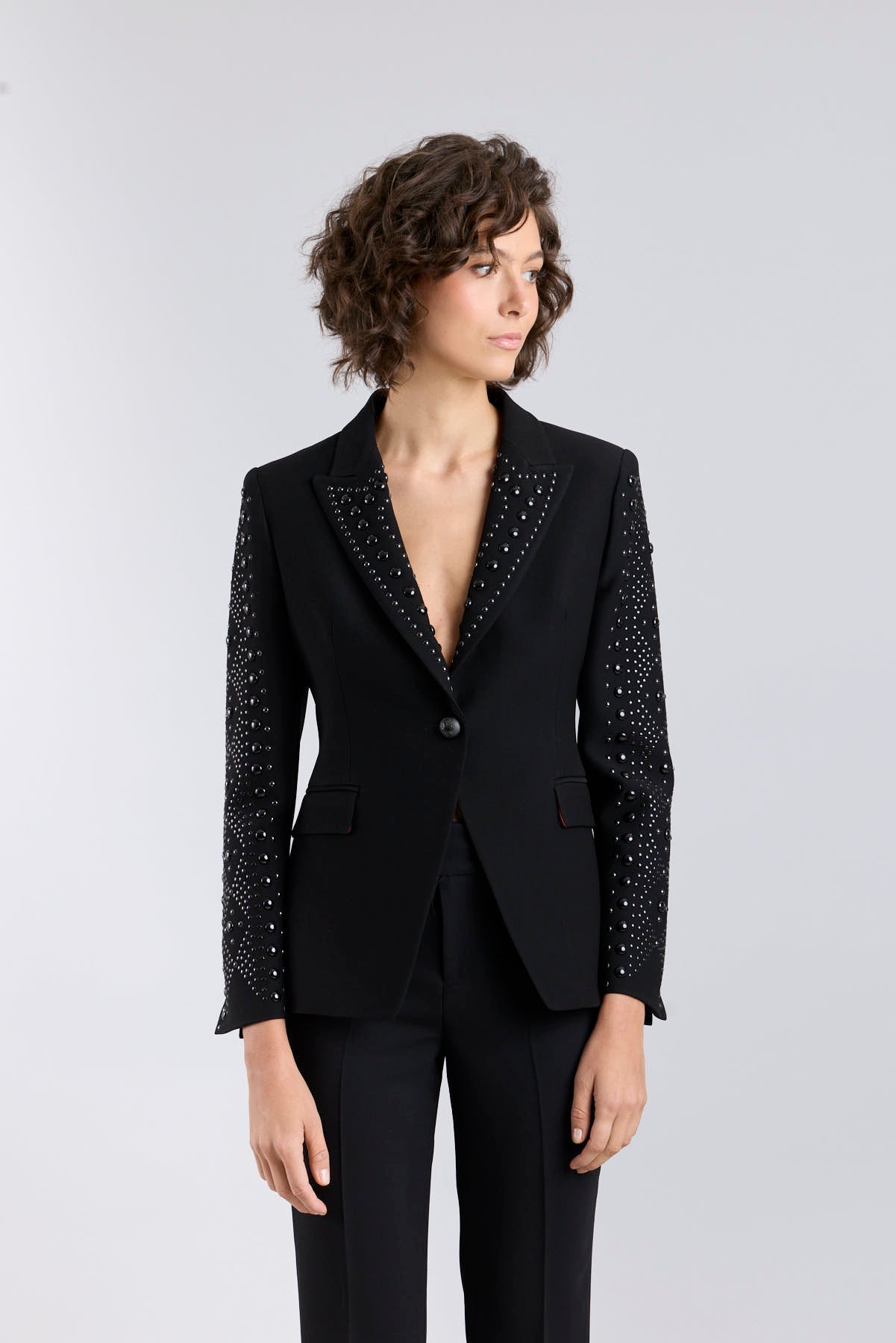Women’s Lord Byron black tailored blazer with hand-applied metallic studs along the lapels and pockets.