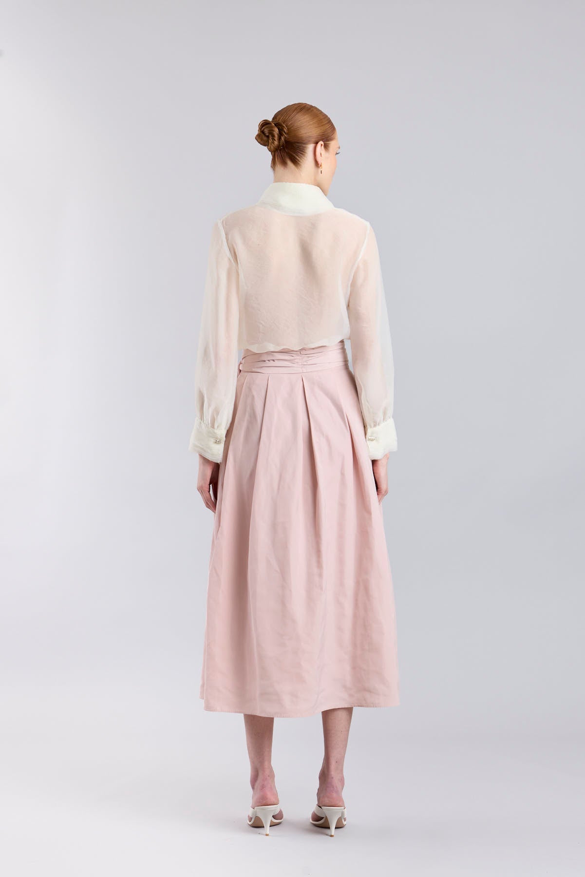 Structured dusty pink midi skirt with volume and waist bow detail by The Extreme Collection.
