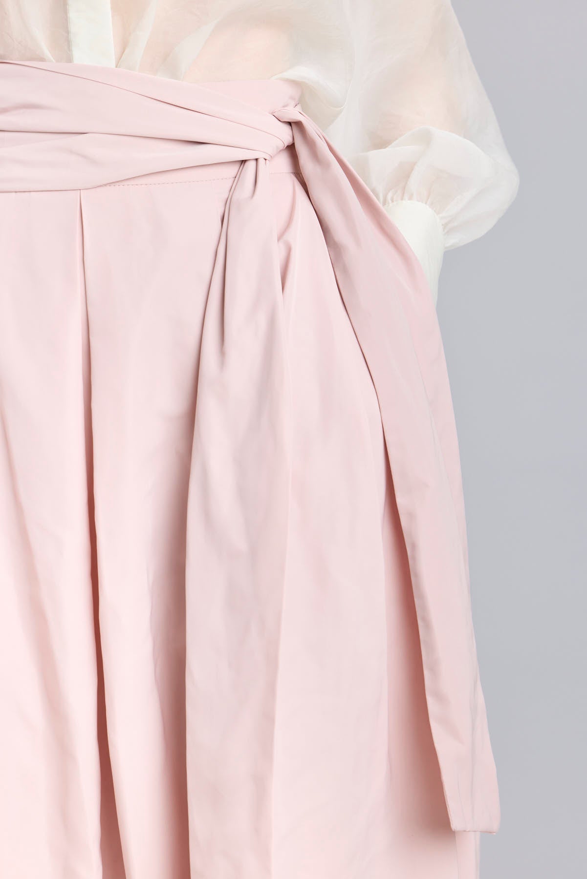 Structured dusty pink midi skirt with volume and waist bow detail by The Extreme Collection.