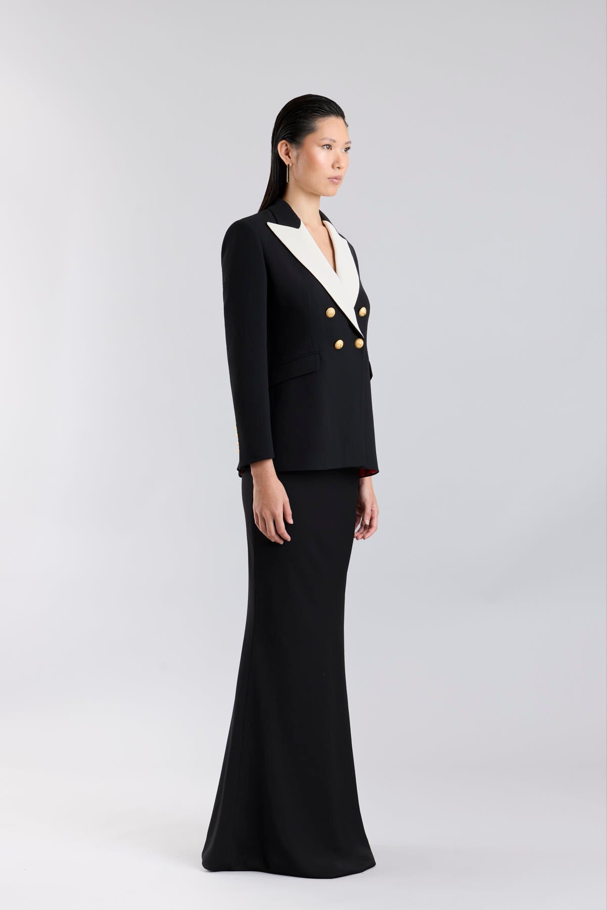 Women’s Iconic Code 01 designer double-breasted blazer in black with optical white peak lapels and gold heraldic buttons.