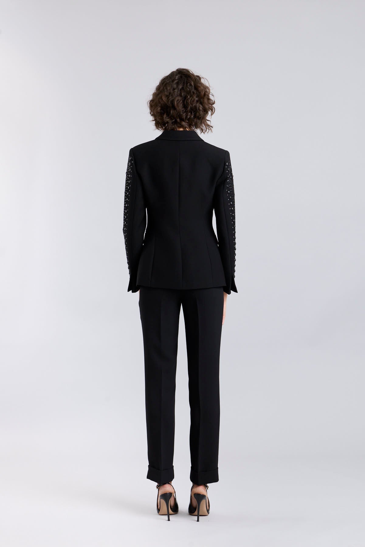 Women’s Lord Byron black tailored blazer with hand-applied metallic studs along the lapels and pockets.
