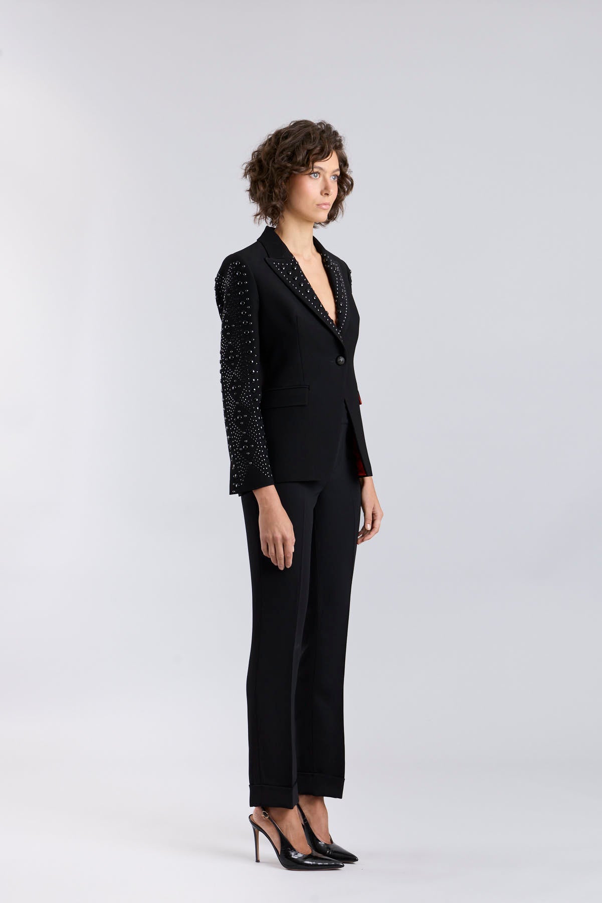 Women’s Lord Byron black tailored blazer with hand-applied metallic studs along the lapels and pockets.