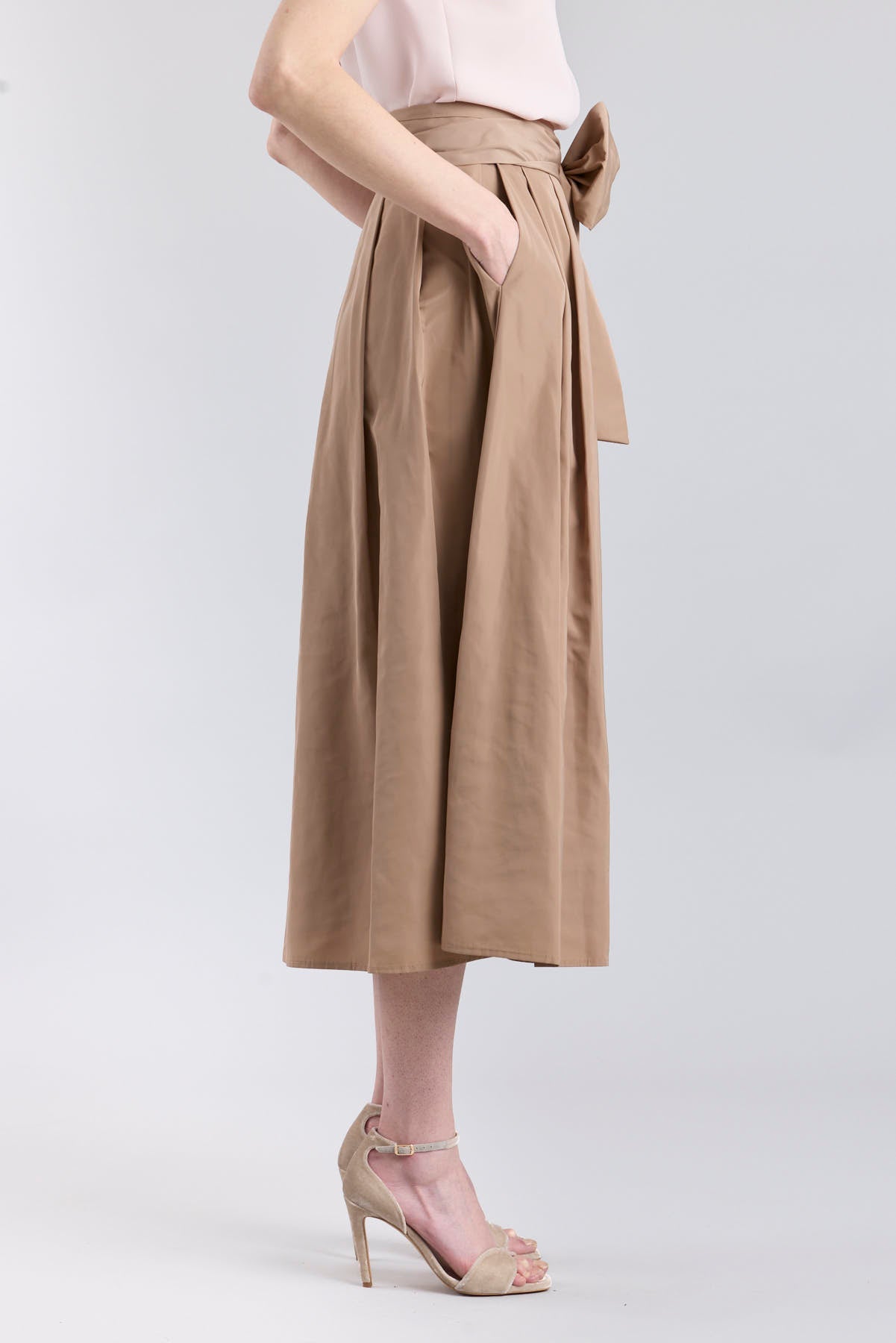 Structured camel midi skirt with volume and waist bow detail by The Extreme Collection.
