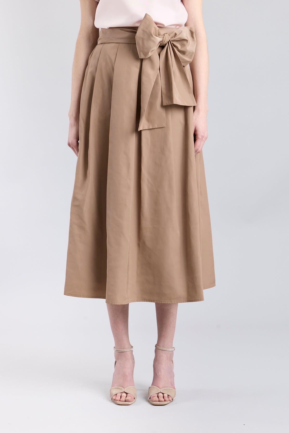 Structured camel midi skirt with volume and waist bow detail by The Extreme Collection.