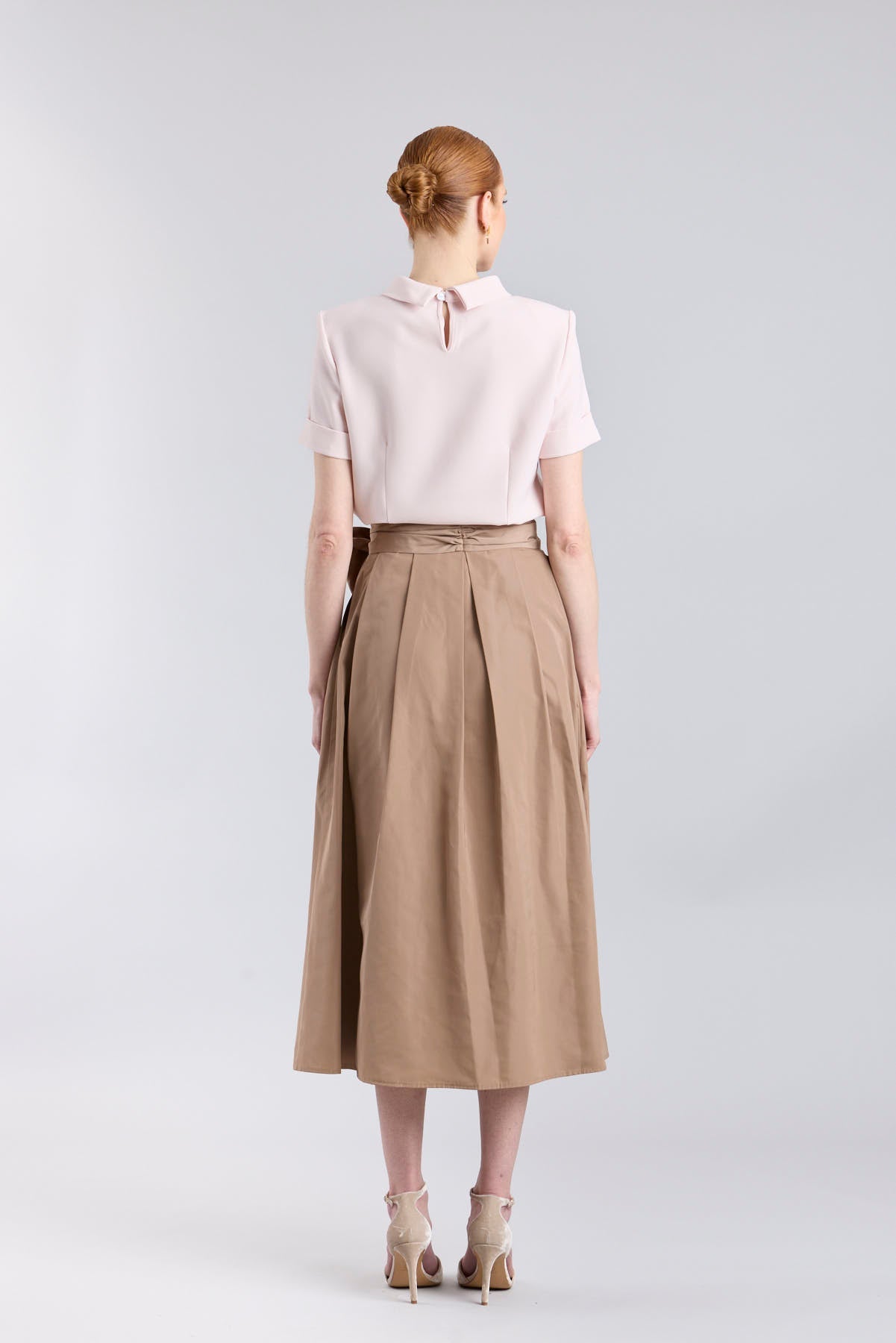 Structured camel midi skirt with volume and waist bow detail by The Extreme Collection.